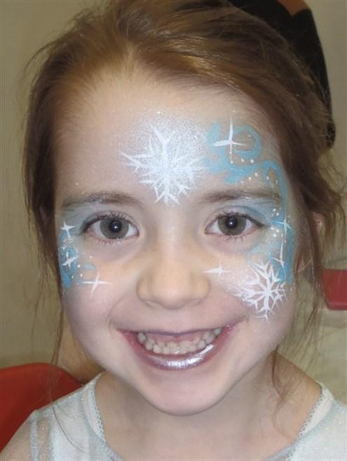 Elsa face painting on little cute girl