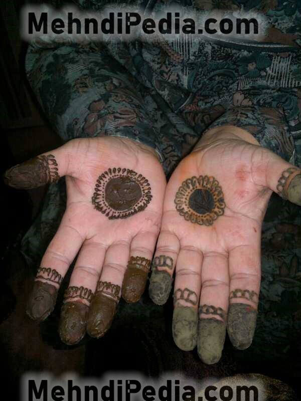front hand circle and finger mehndi designs